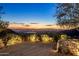 Enjoy breathtaking sunset views from the elevated outdoor living space and stone patio at 11268 E Moonlight Cyn, Scottsdale, AZ 85255