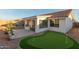 Backyard featuring a putting green, patio and desert landscaping at 11430 E Neville Ave, Mesa, AZ 85209