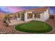 Wide backyard featuring a putting green, patio and desert landscaping at 11430 E Neville Ave, Mesa, AZ 85209