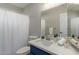 Bathroom with white shower curtain, white countertop, and blue vanity at 11430 E Neville Ave, Mesa, AZ 85209