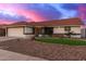 Inviting single-story home featuring desert landscaping, stone accents, and a tile roof at 11430 E Neville Ave, Mesa, AZ 85209