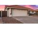 A close-up shot of a white garage door with a tile roof, offering ample space for parking at 11430 E Neville Ave, Mesa, AZ 85209