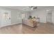 Stylish living room featuring wood-look flooring, neutral colors, and a large window at 11430 E Neville Ave, Mesa, AZ 85209