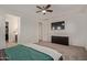 Spacious bedroom featuring neutral carpet, ceiling fan, and a walk-in closet at 11744 S 173Rd Ln, Goodyear, AZ 85338