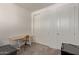 Bedroom showcasing a desk with a chair and a sliding door closet at 11744 S 173Rd Ln, Goodyear, AZ 85338