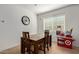 Simple dining room with a wooden table set and a nearby play cash register at 11744 S 173Rd Ln, Goodyear, AZ 85338