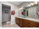 Bathroom with double sinks, spacious counter, and ample storage at 1202 E Winged Foot Rd, Phoenix, AZ 85022