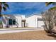 Charming single-story home featuring a two-car garage and desert landscaping at 1202 E Winged Foot Rd, Phoenix, AZ 85022