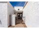 Inviting courtyard entrance featuring double doors and decorative wrought iron gate at 1202 E Winged Foot Rd, Phoenix, AZ 85022