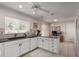 Well-lit kitchen with white cabinetry, dark countertops, and tiled floors at 1202 E Winged Foot Rd, Phoenix, AZ 85022