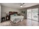 Spacious main bedroom with decorative headboard and sliding glass door at 1202 E Winged Foot Rd, Phoenix, AZ 85022