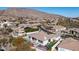 Aerial view of a desert community showcasing well-maintained homes and mountain scenery at 122 E Desert Wind Dr, Phoenix, AZ 85048