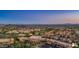 Expansive aerial shot showcasing commercial areas, and a golf community at 122 E Desert Wind Dr, Phoenix, AZ 85048