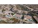 An aerial view displaying a luxury home with a swimming pool, basketball court and landscaped backyard at 122 E Desert Wind Dr, Phoenix, AZ 85048