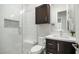 Modern bathroom with a glass shower, sleek vanity, and stylish tiled niche at 122 E Desert Wind Dr, Phoenix, AZ 85048