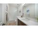 Well-lit bathroom features white subway tiles in the shower with dark vanity at 122 E Desert Wind Dr, Phoenix, AZ 85048