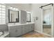 Bathroom featuring dual vanities, tiled floors, and a separate tub and shower room at 122 E Desert Wind Dr, Phoenix, AZ 85048