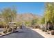 Gated entrance to a private community with desert landscaping and mountain views at 122 E Desert Wind Dr, Phoenix, AZ 85048