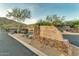 Elegant stone sign marking the entrance to the Whistling Rock community at 122 E Desert Wind Dr, Phoenix, AZ 85048