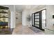 Elegant home foyer featuring stone accents and stylish lighting at 122 E Desert Wind Dr, Phoenix, AZ 85048