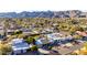 Scenic aerial shot of a home nestled in a mountain view community at 12222 S Appaloosa Dr, Phoenix, AZ 85044