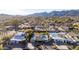 Overhead view of a well-maintained neighborhood with mountain backdrop at 12222 S Appaloosa Dr, Phoenix, AZ 85044