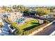 Aerial view of a private pool and a sprawling landscaped yard featuring a plush lawn and desert foliage at 12222 S Appaloosa Dr, Phoenix, AZ 85044