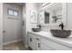 Bathroom featuring a double sink vanity with white countertops and bowl sinks at 12222 S Appaloosa Dr, Phoenix, AZ 85044