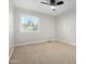 Bedroom with a ceiling fan and a large window that provides ample natural light at 12222 S Appaloosa Dr, Phoenix, AZ 85044