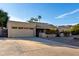 Inviting single-story home with desert landscaping, a spacious driveway, and a tile roof at 12222 S Appaloosa Dr, Phoenix, AZ 85044