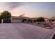 Single-story home featuring desert landscaping, an attached garage, and a brick-lined driveway at 12222 S Appaloosa Dr, Phoenix, AZ 85044