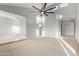 Spacious living room with high ceilings, a modern ceiling fan, and lots of natural light at 12222 S Appaloosa Dr, Phoenix, AZ 85044