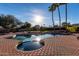 Beautiful backyard pool with lush landscaping and sun-drenched patio at 12222 S Appaloosa Dr, Phoenix, AZ 85044