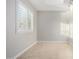 Bright room with tile flooring, a window with white shutters, and neutral walls at 12222 S Appaloosa Dr, Phoenix, AZ 85044