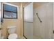 Full bathroom with white toilet and shower with safety bar at 12323 W Fieldstone Dr, Sun City West, AZ 85375