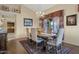 Formal dining area with a chandelier, large table and attractive decor at 12323 W Fieldstone Dr, Sun City West, AZ 85375