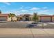 Charming single-story home featuring mature landscaping and inviting curb appeal at 12323 W Fieldstone Dr, Sun City West, AZ 85375