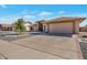 Well-maintained single-story home featuring a two car garage and desert landscaping at 12323 W Fieldstone Dr, Sun City West, AZ 85375