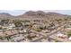 Scenic aerial view of a neighborhood nestled against a picturesque mountain backdrop at 13234 N 2Nd St, Phoenix, AZ 85022