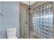 Modern bathroom with glass enclosed shower with blue-painted accent wall at 13234 N 2Nd St, Phoenix, AZ 85022