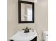 The secondary bathroom features modern black vanity, sink and toilet at 13234 N 2Nd St, Phoenix, AZ 85022