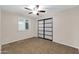 Cozy bedroom with tiled floors, ceiling fan, and sliding closet doors at 13234 N 2Nd St, Phoenix, AZ 85022