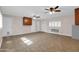 This open living room includes neutral paint and floors, and a ceiling fan at 13234 N 2Nd St, Phoenix, AZ 85022