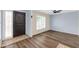 Bright living room with wood floors, ceiling fan, and window shutters allows for natural light at 13234 N 2Nd St, Phoenix, AZ 85022