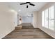 Open-concept living room with luxury vinyl plank flooring and a seamless transition to the kitchen area at 13234 N 2Nd St, Phoenix, AZ 85022