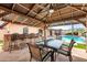 Entertain guests in this outdoor kitchen and dining area next to a pool at 13234 N 2Nd St, Phoenix, AZ 85022