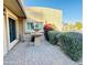 Private patio area featuring brick pavers, a water fountain, and lush landscaping for peaceful outdoor living at 13234 N 2Nd St, Phoenix, AZ 85022