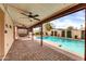 Enjoy the covered patio overlooking the sparkling pool and lush desert landscape at 13234 N 2Nd St, Phoenix, AZ 85022