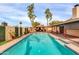 Aerial view of sparkling blue pool and outdoor kitchen with covered pergola at 13234 N 2Nd St, Phoenix, AZ 85022