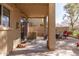 Spacious covered back patio area with brick pavers, providing a shaded retreat for outdoor living at 1350 S Greenfield Rd # 1215, Mesa, AZ 85206